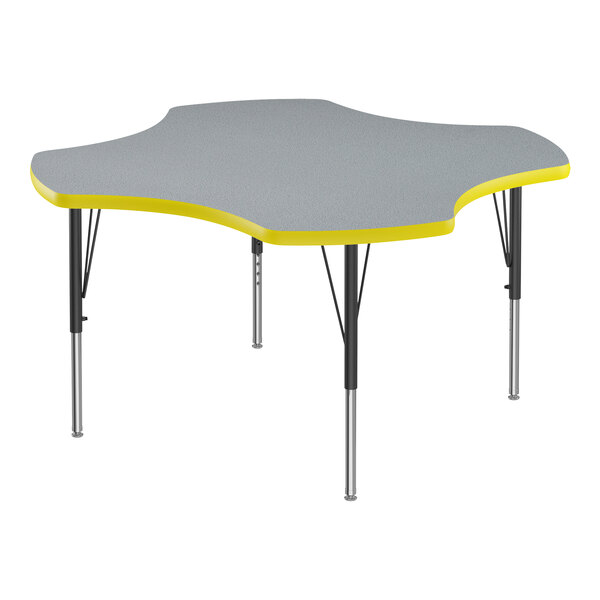 A gray high-pressure laminate activity table with yellow trim on the edge and black legs.