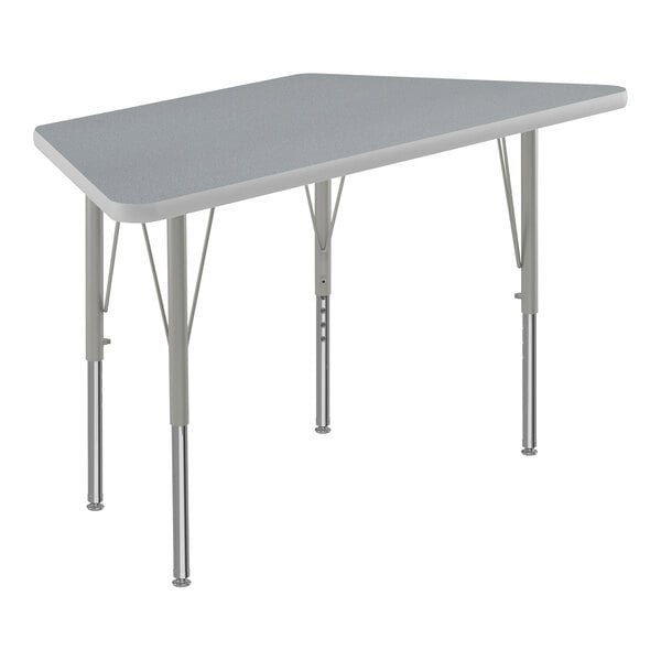 A grey trapezoid table with metal legs.
