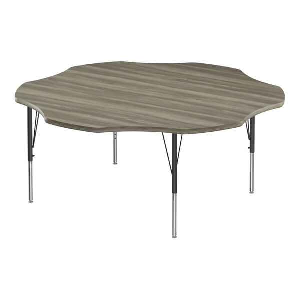A Correll activity table with a wood surface and black legs with driftwood trim.