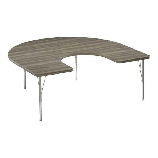 A half-moon shaped New England Driftwood activity table with silver metal legs and driftwood T-mold.