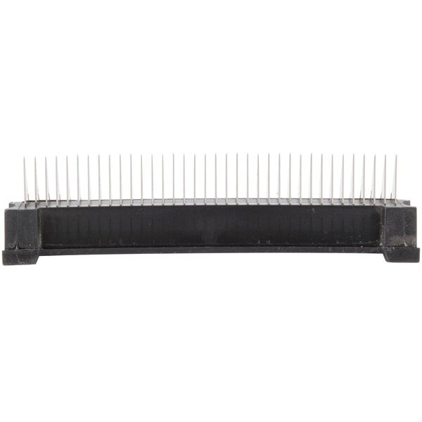 A black rectangular object with many small needles.