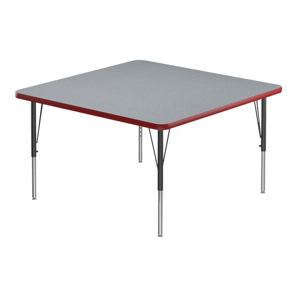 A square gray activity table with black legs and a red edge.