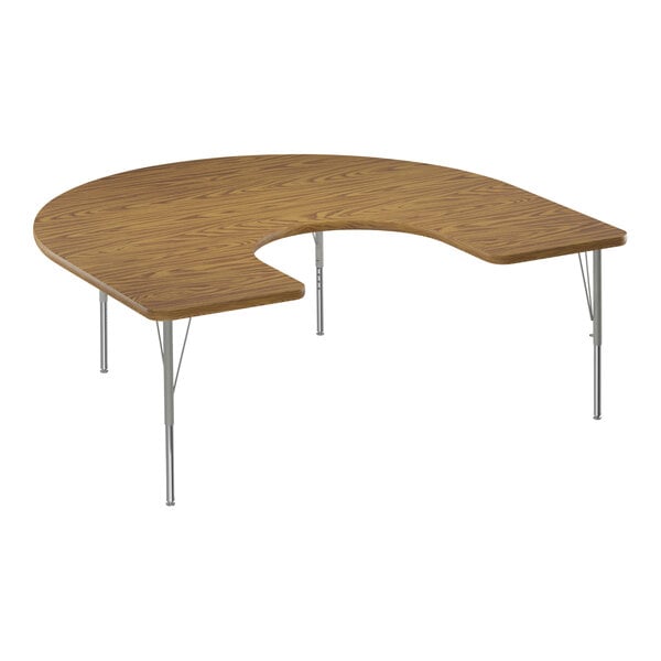 A wooden horseshoe-shaped activity table with silver legs.