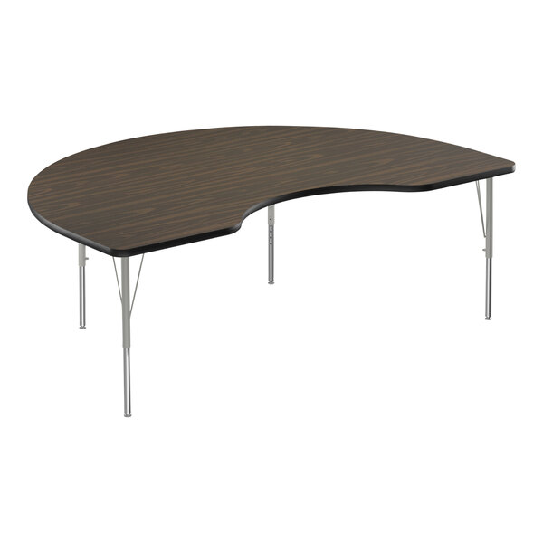 A Correll Kidney Activity Table with silver metal legs and a black curved top.