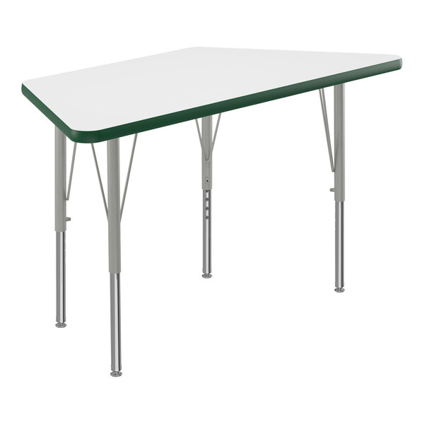 A white trapezoid activity table with silver legs and green edge.