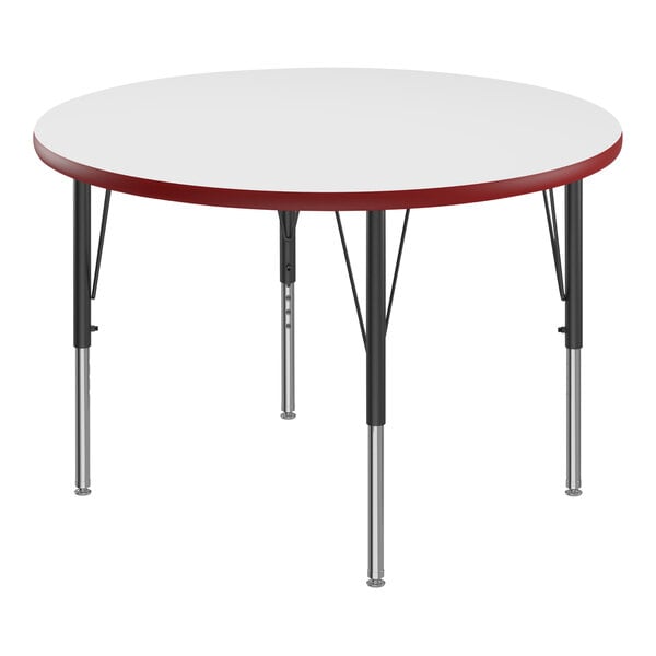 A white round Correll activity table with red edges and black legs.