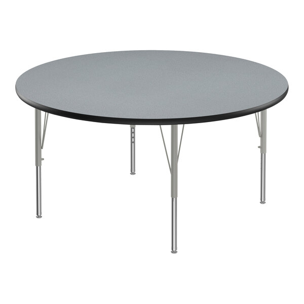 A round Correll activity table with a gray granite top and silver legs.