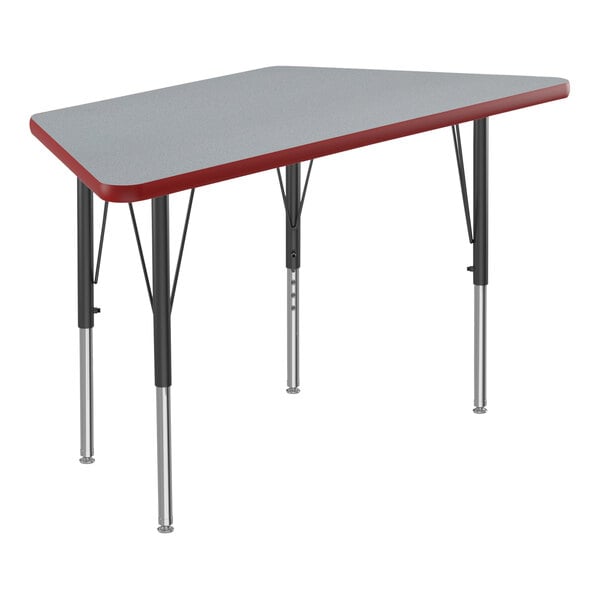A grey trapezoid activity table with black legs and red trim.