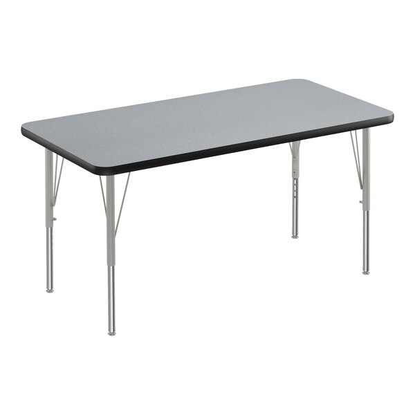 A rectangular Correll activity table with a gray granite top and silver legs.