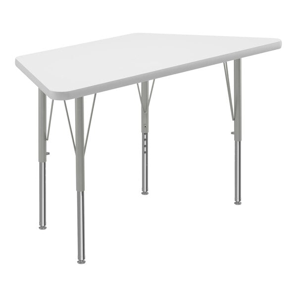 A white trapezoid activity table with silver legs.