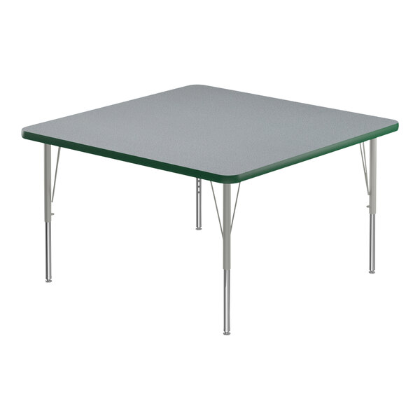 A square gray high-pressure laminate activity table with silver legs and green T-mold edge.