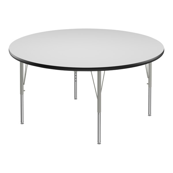 A white Correll round activity table with silver metal legs.