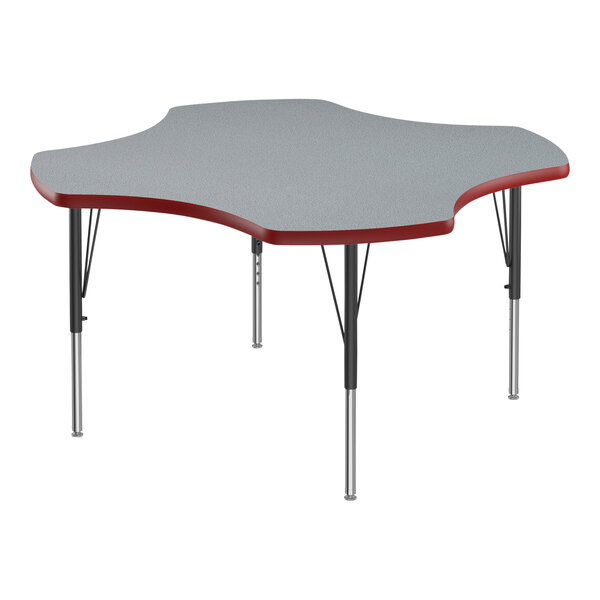 A close-up of a grey high-pressure laminate activity table with black legs and red t-mold.