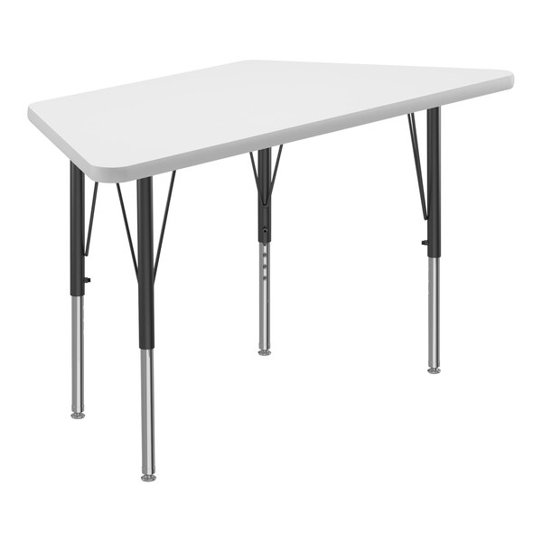 A white trapezoid-shaped Correll activity table with black legs.
