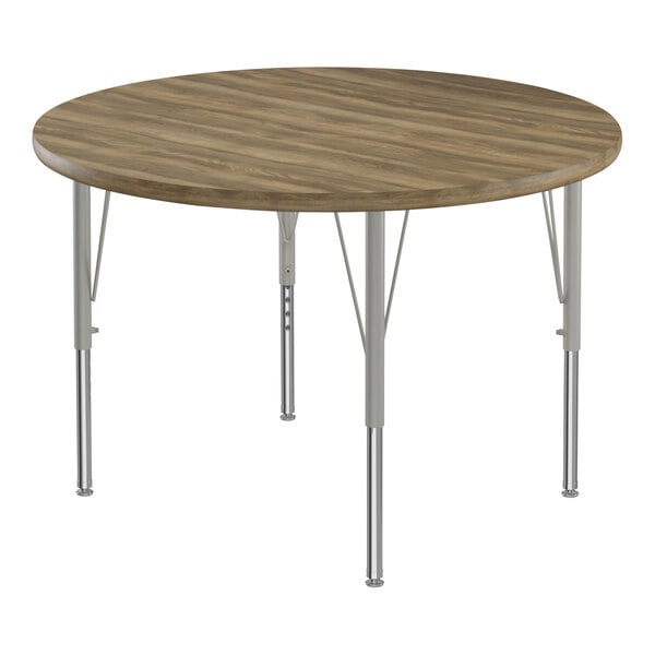 A Correll round activity table with metal legs and a hickory top.