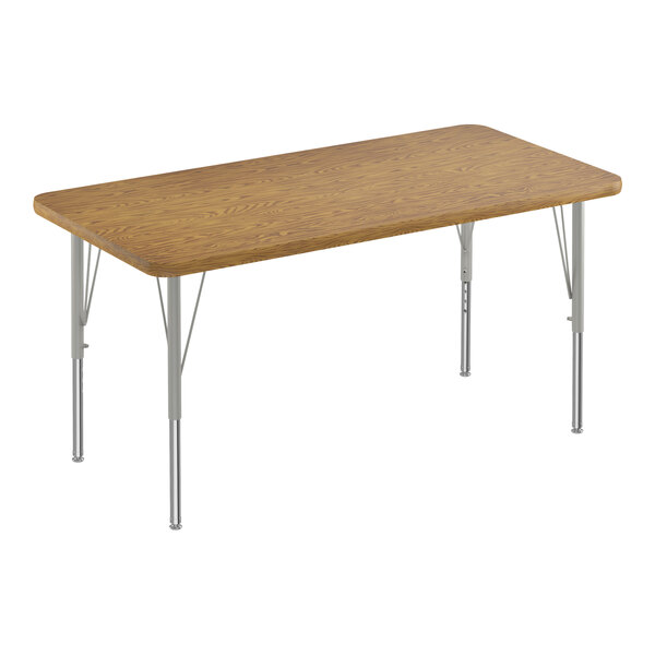 A rectangular wooden table with silver legs.