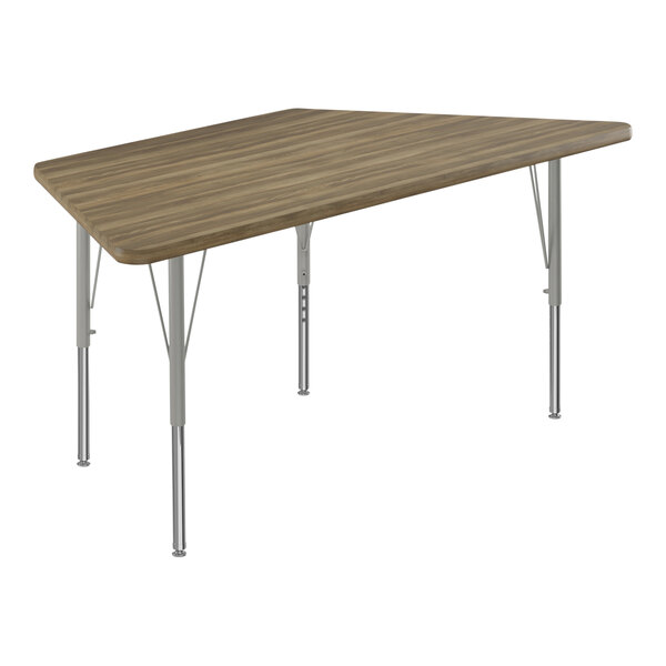 A trapezoid activity table with silver legs and a hickory wood surface.