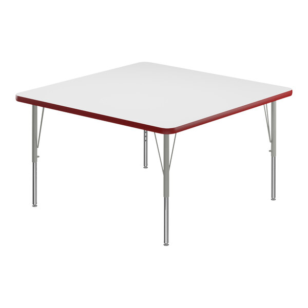 A white square Correll activity table with silver legs and a red edge.