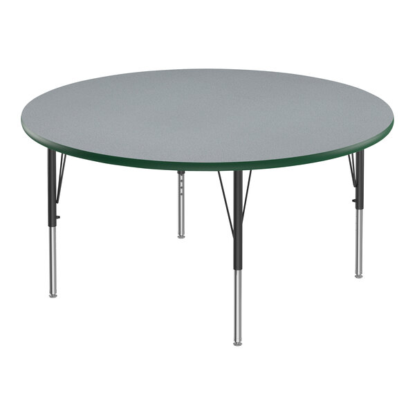 A round gray Correll activity table with black legs and green edge.