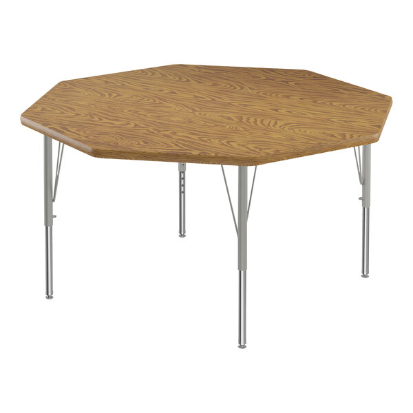 A medium oak wooden activity table with silver legs.