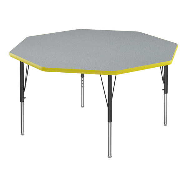 A grey and yellow hexagon table with black legs.
