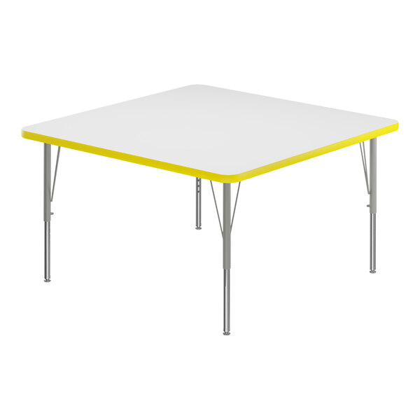 A white square Correll activity table with a yellow edge.