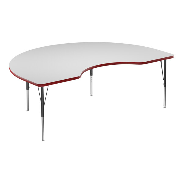 A white Correll activity table with a curved top and red trim.