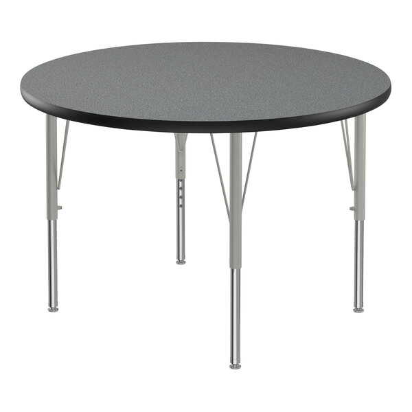 A round Correll activity table with silver legs and a black T-molded edge.