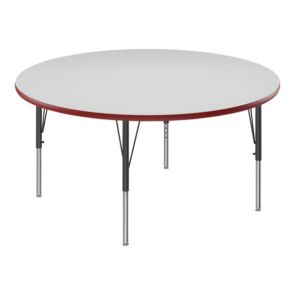 A white round table with a red edge.