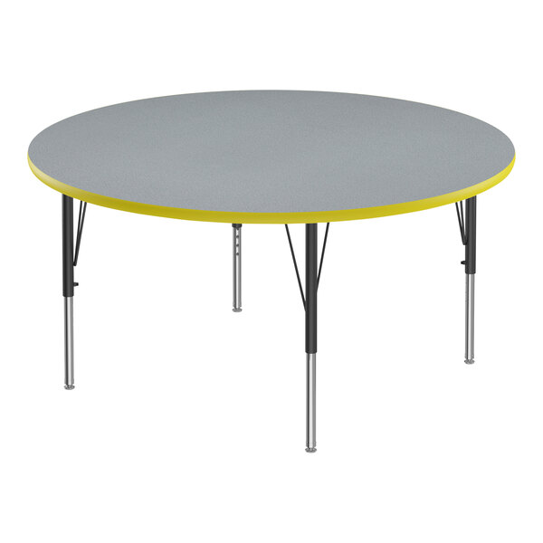 A round grey table with yellow edges.