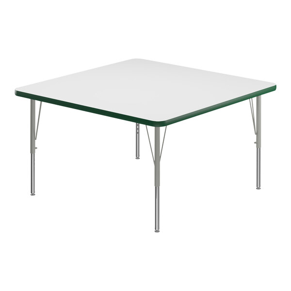 A white square Correll activity table with silver legs and a green edge.