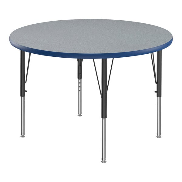 A Correll round activity table with a blue top and black legs.