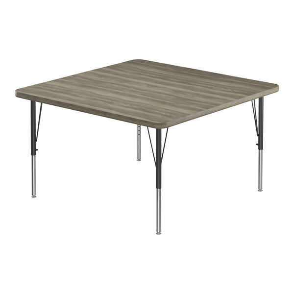A square Correll activity table with a New England Driftwood top and metal legs.