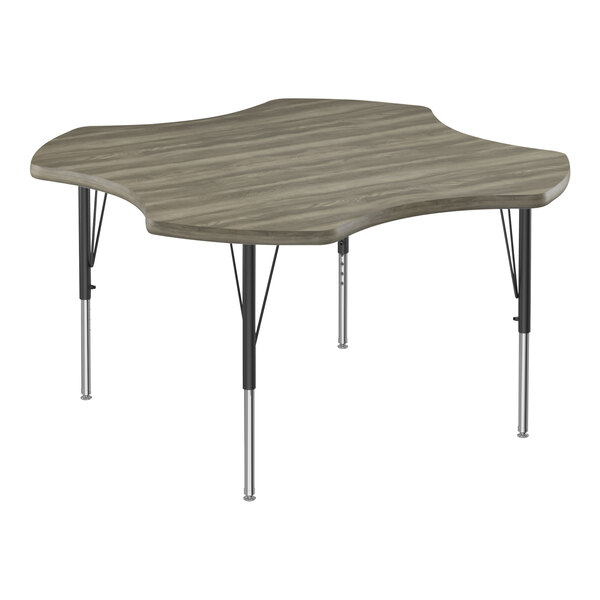 A rectangular Correll activity table with a Driftwood laminate top and metal legs.