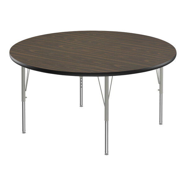 A Correll round activity table with silver metal legs and a dark walnut top.