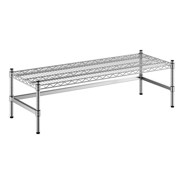 A Regency stainless steel stationary dunnage rack shelf with black legs.