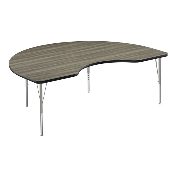 A Correll Kidney-shaped activity table with silver legs and black trim.