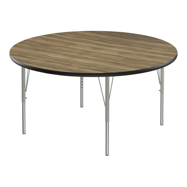 A Correll round activity table with a high-pressure laminate top and metal legs.