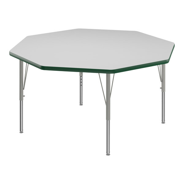 A white hexagon table with silver legs and green T-mold.