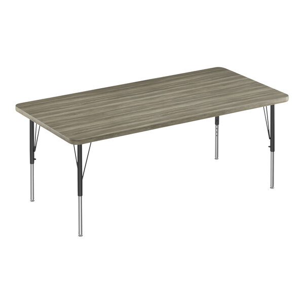 A rectangular Correll activity table with a New England Driftwood top and metal legs.