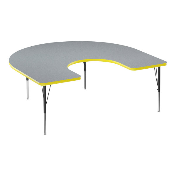 A grey and yellow Correll horseshoe-shaped activity table.