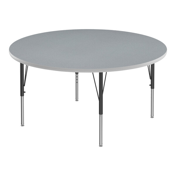 A Correll round activity table with gray top and black legs.