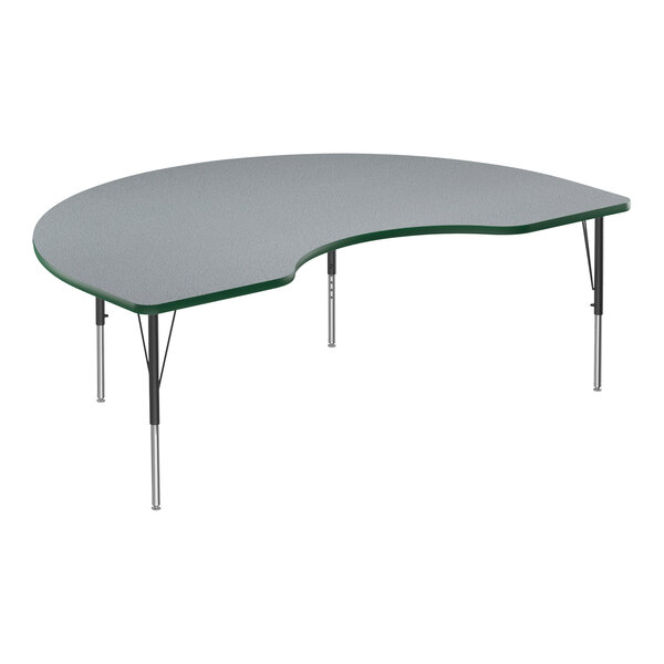 A grey table with a curved top and green edge supported by black metal legs.