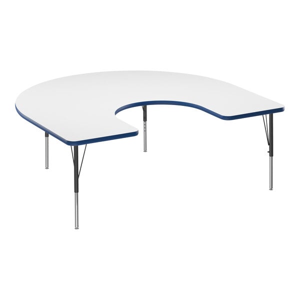 A white Correll horseshoe activity table with a blue edge.
