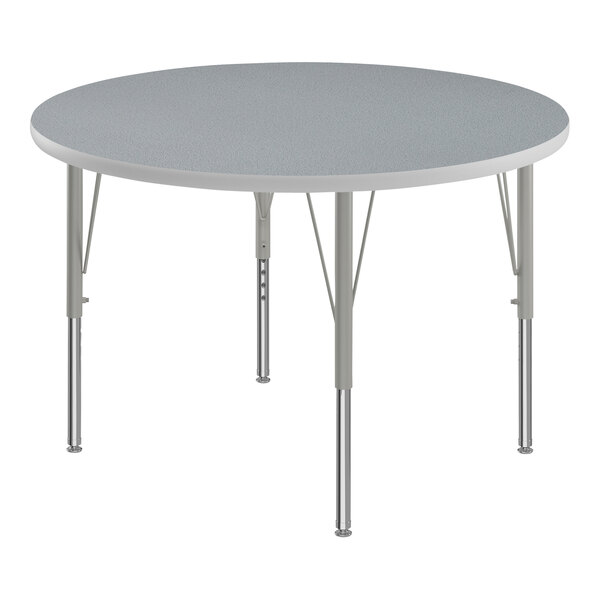 A Correll round activity table with gray top and silver legs.