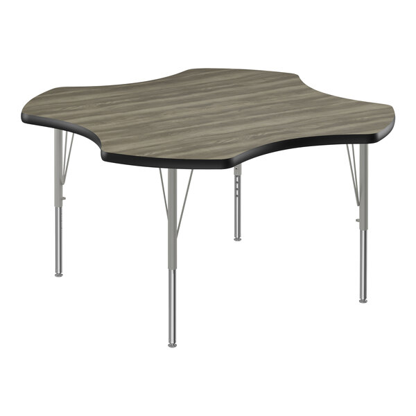 A Correll activity table with a rectangular New England Driftwood high-pressure laminate wood top with black T-mold.