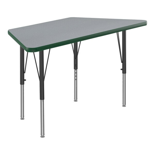 A grey trapezoid Correll activity table with black legs and green T-mold.