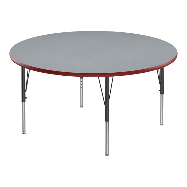 A round Correll activity table with a gray top and red T-molded edge and black legs.