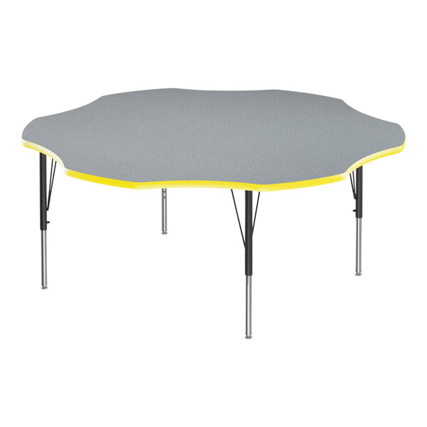 A Correll flower shaped activity table with gray and yellow top and yellow T-Mold.