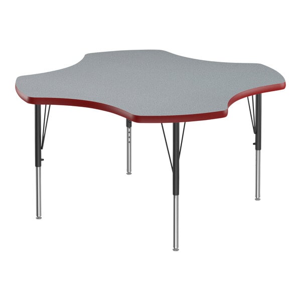 A close-up of a grey table with red edges and black legs.